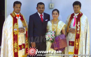 Arun Ravi Nisha with Priests Photo